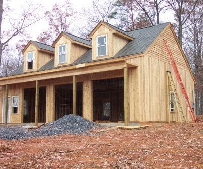 Back prime and seal end-cuts in cedar siding before final installation.