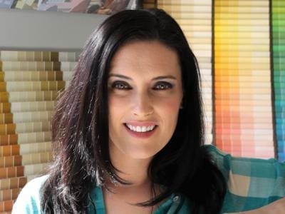 Laurie March in front of Paint samples - MyFixitUpLife