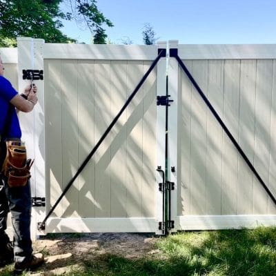 Mark fixes vinyl fence gate upper with adjustable wrench MyFixitUpLife