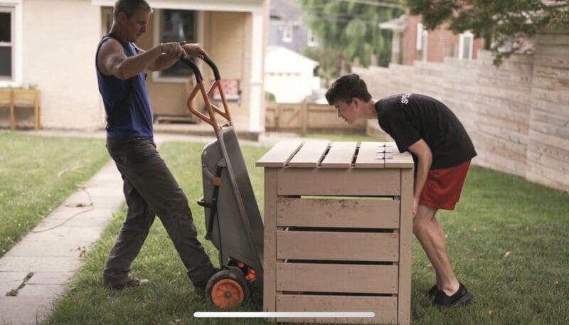 ‣ MyFixitUpLife Lifting the compost bin to move it to its spot in the yard