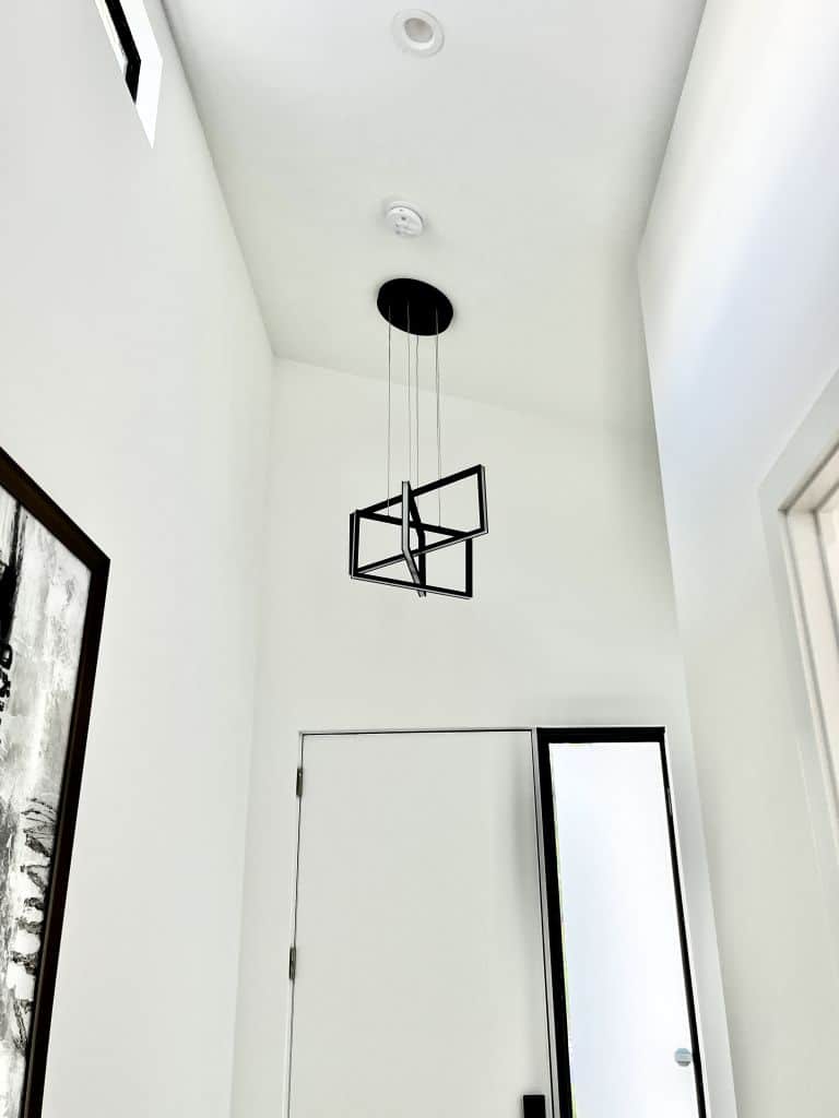 a statement light can set the tone of an entryway - myfixituplife